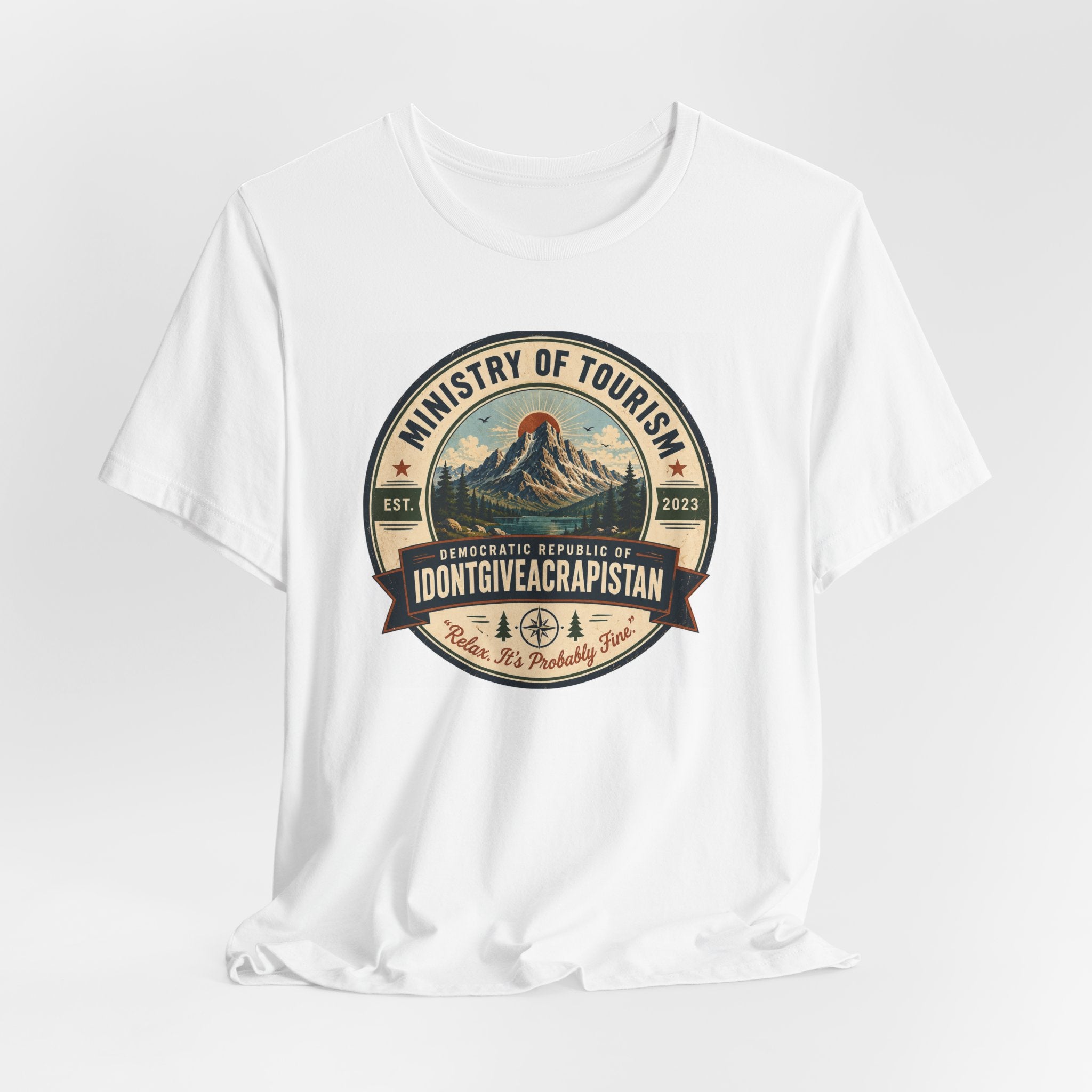 Tourism Badge Tee — "Ministry of Tourism: IDONTGIVEACRAPISTAN" Vintage Mountain T-Shirt