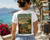 Women's Vintage Travel Poster Tee – "Visit Idontgiveacrapistan" Graphic T-Shirt